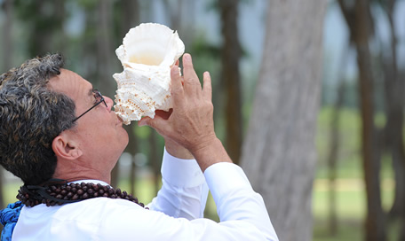 Wedding minister in Hawaii on Oahu Honolulu Paul at the base of the flower ceremonial heart conecting to the source mana of the area